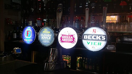 Beer Pumps on bar in pub